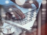 depositphotos_80183376-Doctor-working-with-digital-tablet-and-laptop-computer-in-medica